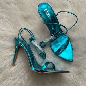 Blue metallic lace up heels.